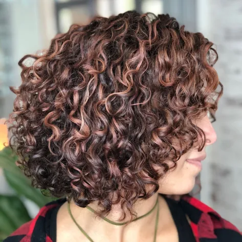 Brown Curly Bob with Rose Gold Highlights