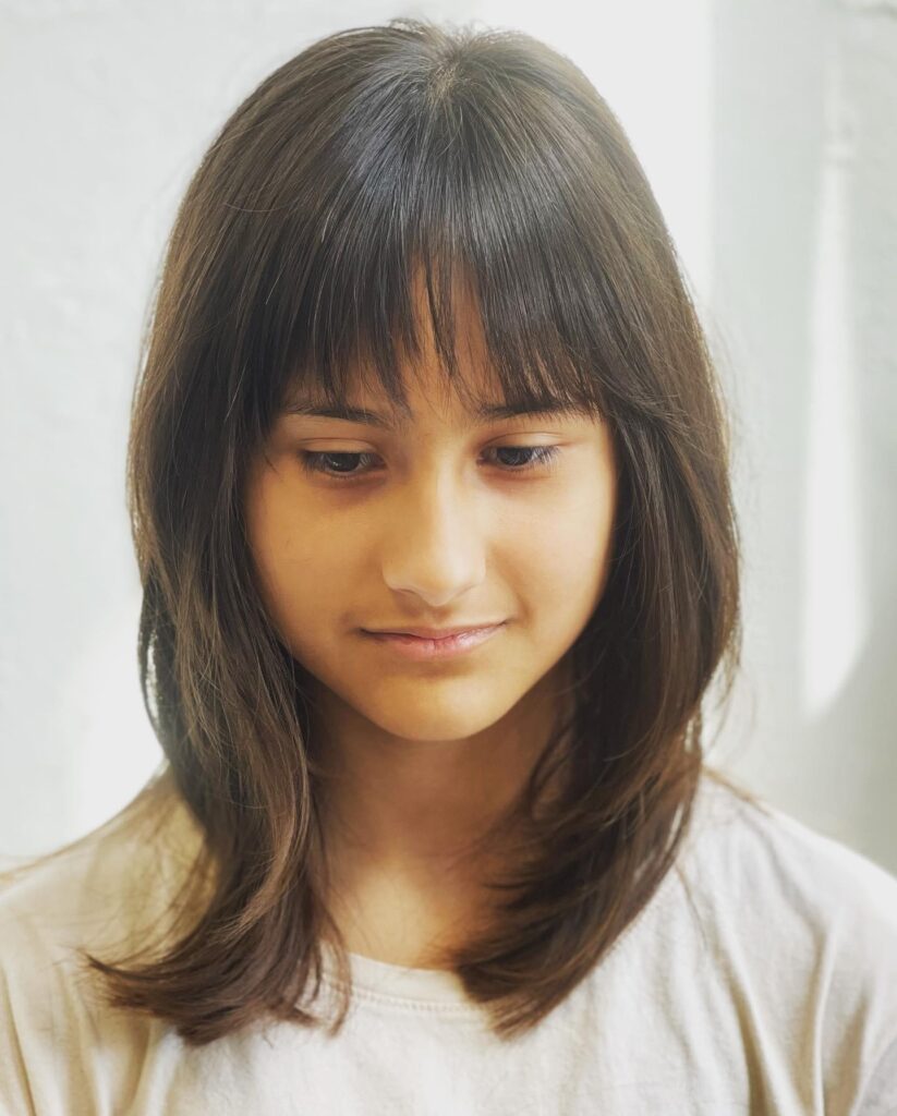 Textured Brunette Layers With Wispy Fringe