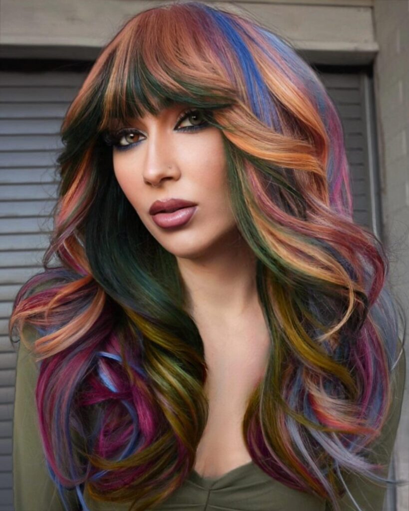 Floral Inspired Multi-Colored Highlights on Layered Hair With Birkin Bangs