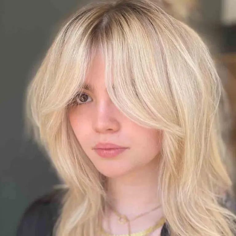 Bleached Blonde Fluffy Wolf Cut With Curtain Bangs