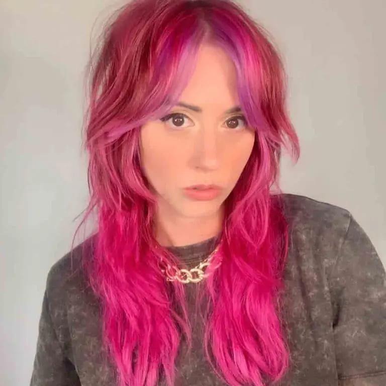 Long Shaggy Wolf Cut With Curtain Bangs on Pink Hair