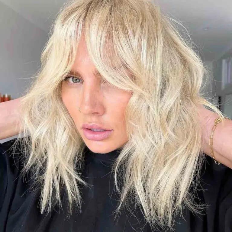 Blonde Shaggy Wolf Cut With Curtain Bangs
