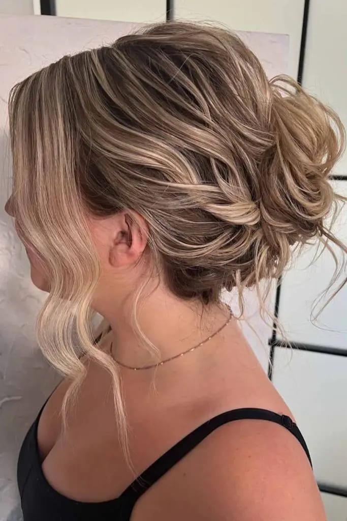 Messy Curled Bun With Loose Waves