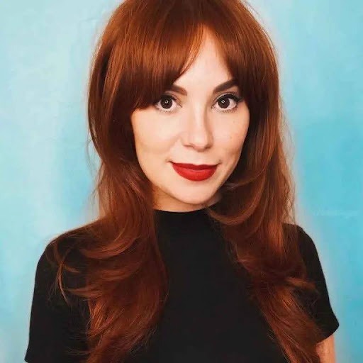 Auburn Layered Wolf Cut With Choppy Curtain Bangs