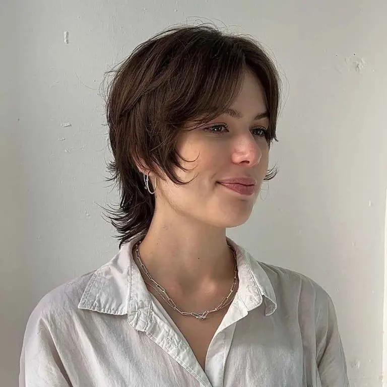 Wolf Cut With Curtain Bangs on Layered Syrup Brown Bob Hair