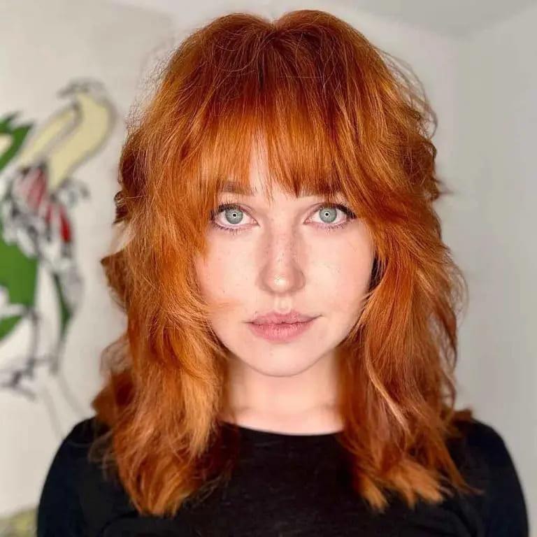 Ginger Wavy Wolf Cut With Face Layers and Bangs on Medium Hair