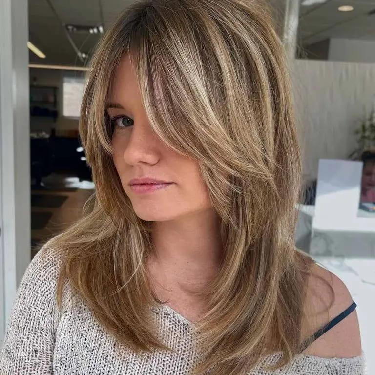 Shaggy Wolf Cut With Blonde Balayage With Face Layers