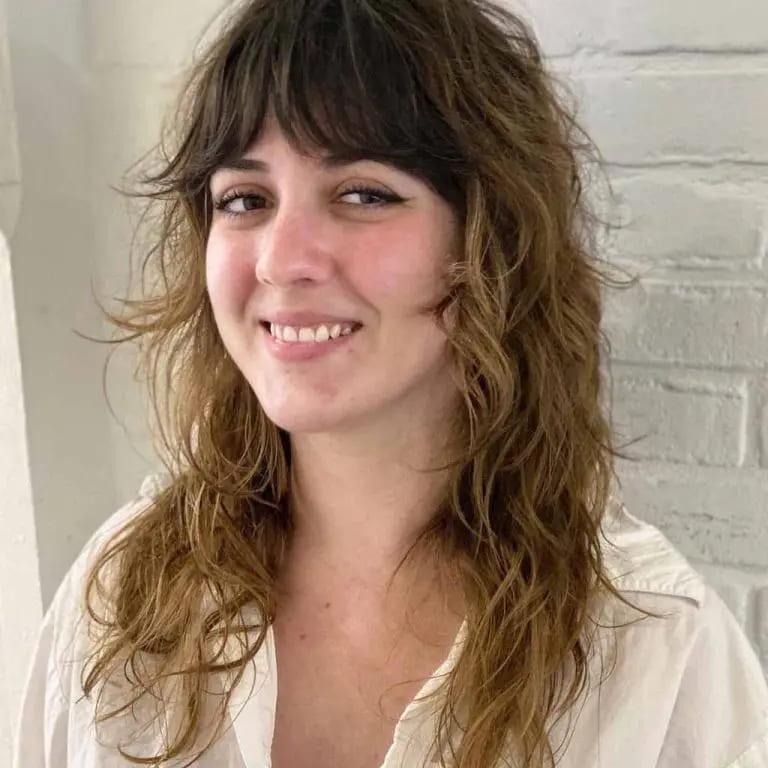 Curly Mullet Wolf Cut With Balayage and Curtain Bangs