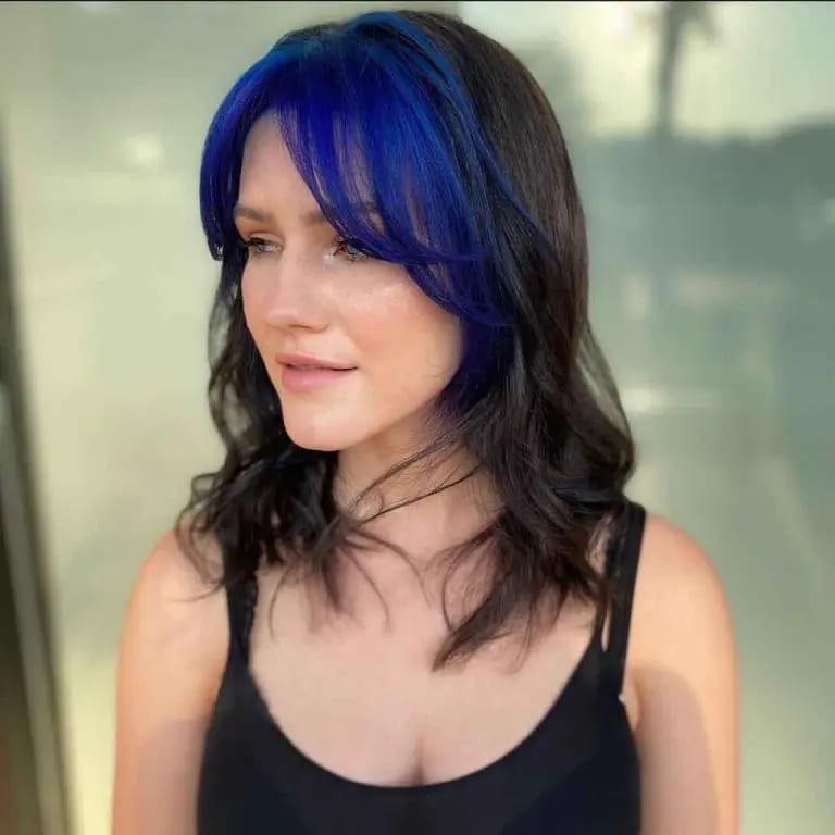 Medium-Length Wolf Cut With Blue Curtain Bangs