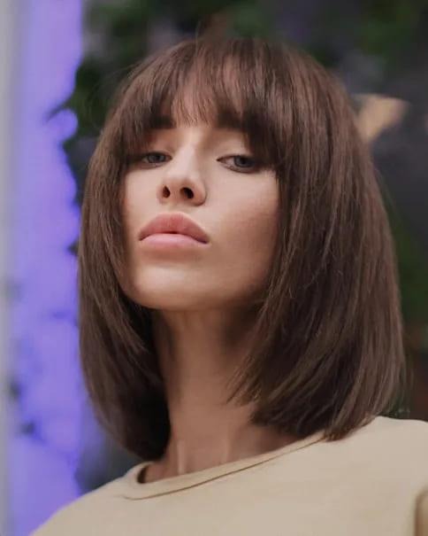 With Arched Bangs