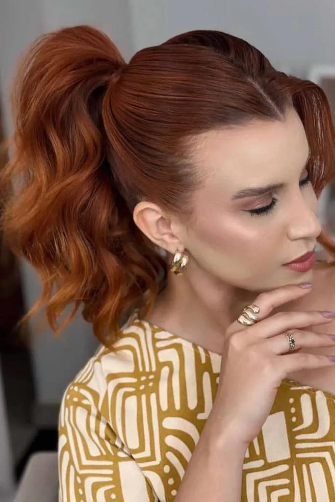 High Voluminous Ponytail With Rich Auburn Curls