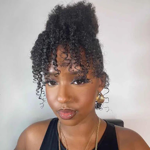 Short Curly Hair With a Messy Top Bun