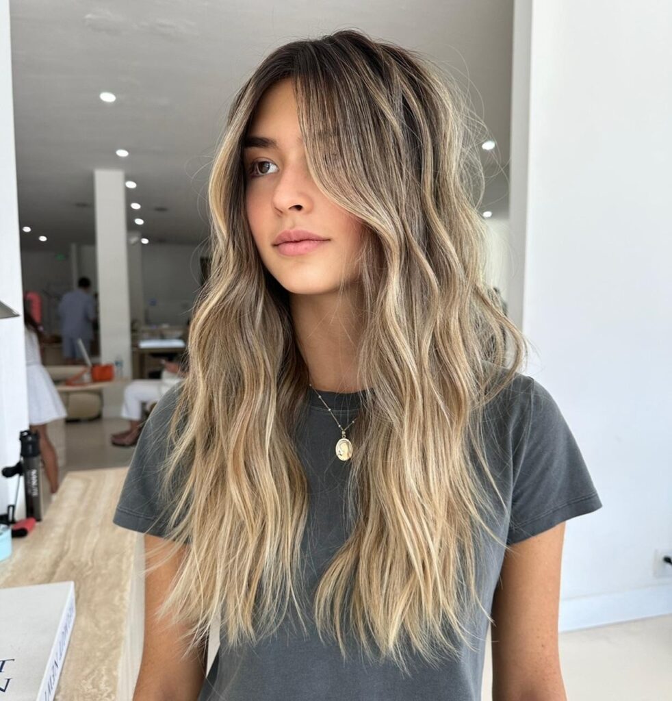 Long Layered Wavy Brunette Hair With Face Framing Layers