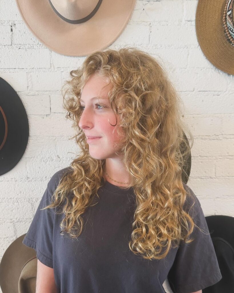 Medium Curly Gypsy Shag Cut With Side-Swept Bangs