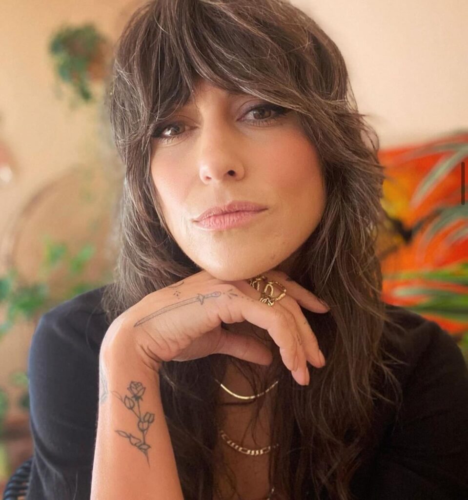 Layered Wolf Cut With Side-Swept Bangs